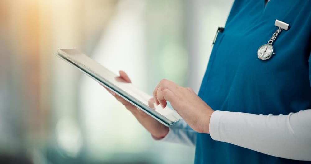 Clinician reviewing a supply list on a tablet